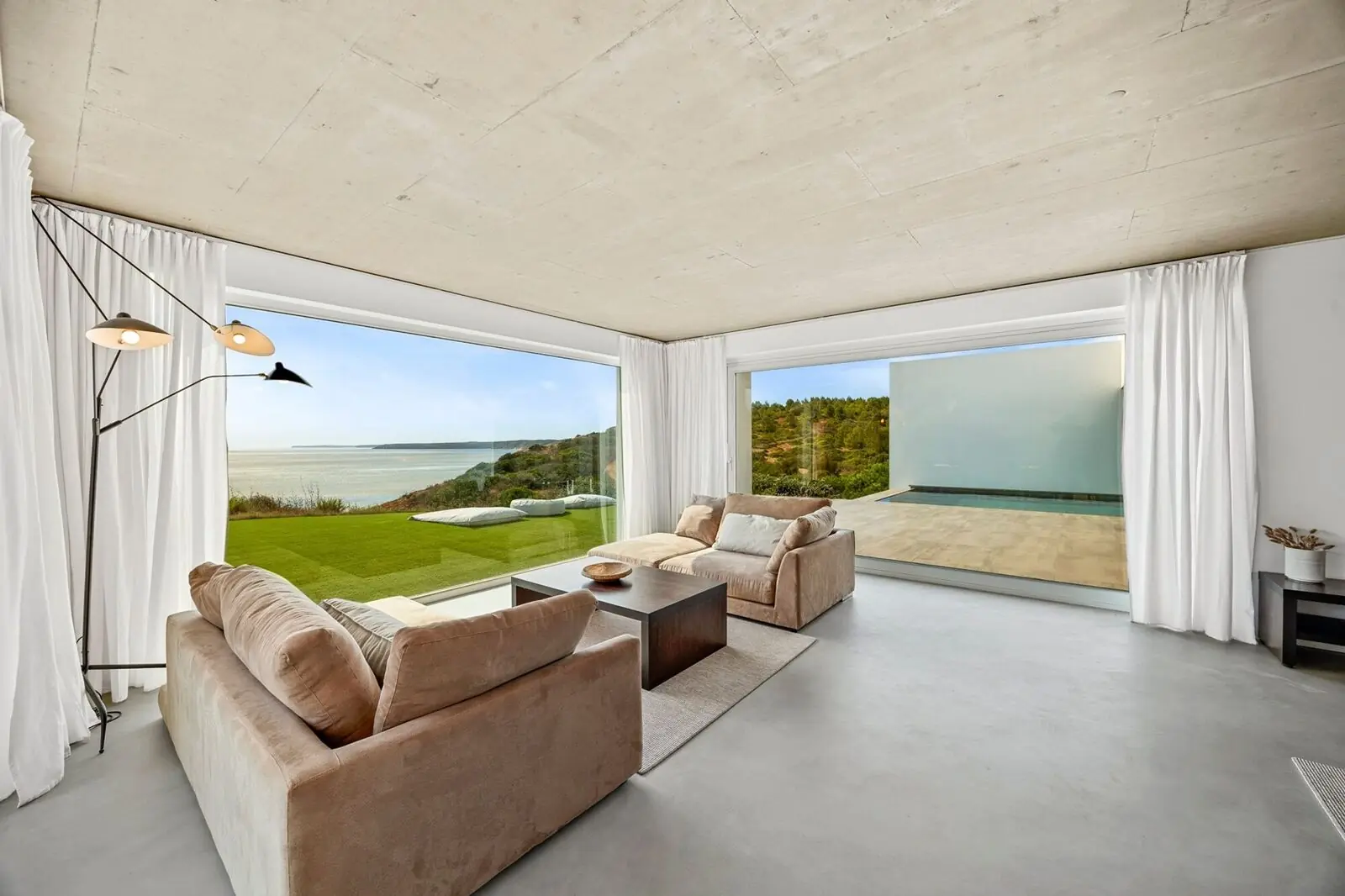 Living room framed by floor-to-ceiling glazing